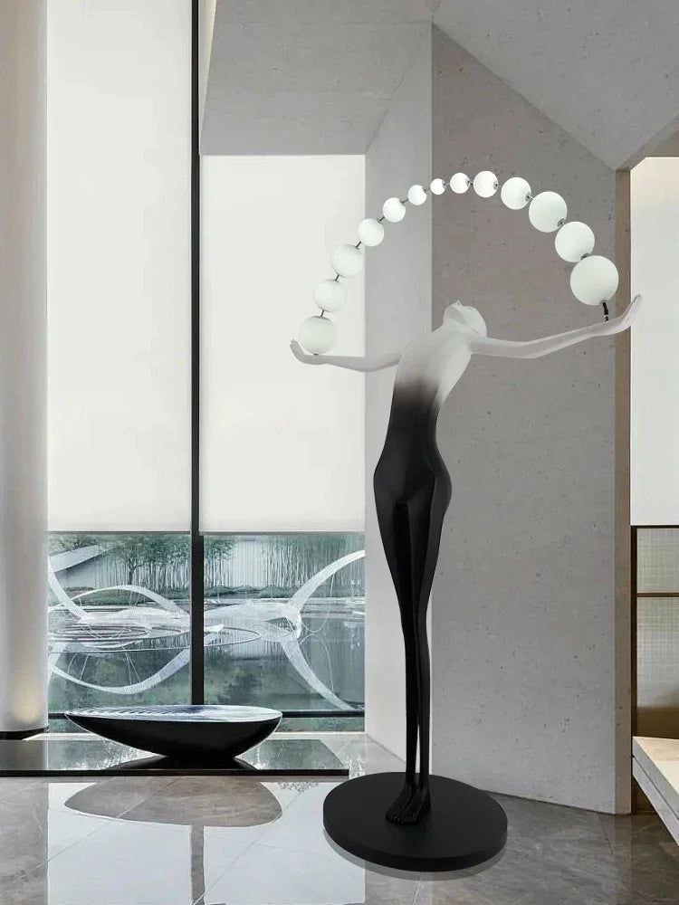 Humanoid Sculpture Holding Ball Floor Lamp