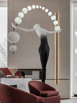 Humanoid Sculpture Holding Ball Floor Lamp