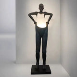 Humanoid Sculpture Holding Floor Lamp