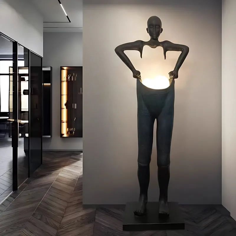 Humanoid Sculpture Holding Floor Lamp